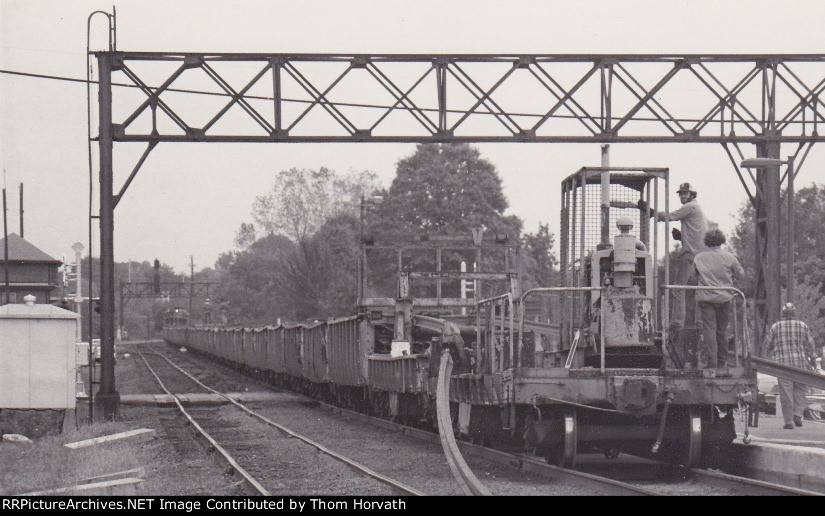 Laying welded rail past what was the passenger platforms